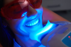 happy lady doing teeth treatment in dental clinic